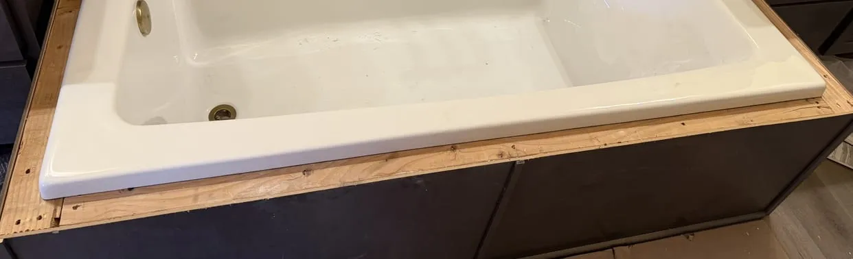 New soaking tub set into a framed deck during a bathroom remodel